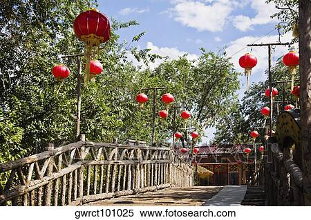 Low angle view of Chinese lanterns hanging on both sides of a footbridge, HohHot, Inner Mongolia, China View Large Photo Image Stock Photography - Low angle view of Chinese lanterns hanging on both sides of a footbridge, HohHot, Inner Mongolia, China. Fotosearch