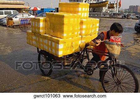 Man pulling a cart, Shamian Island, Guangzhou, Guangdong Province, China View Large Photo Image Stock Image - Man pulling a cart, Shamian Island, Guangzhou, Guangdong Province, China. Fotosearch