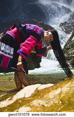 Portrait of a mature woman washing her hair in a waterfall, Jinkeng Terraced Field, Guangxi Province, China View Large Photo Image Stock Photo - Portrait of a mature woman washing her hair in a waterfall, Jinkeng Terraced Field, Guangxi Province, China. Fotosearch