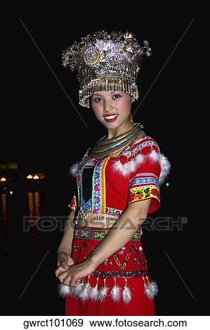 Portrait of a young woman smiling, Guilin, Guangxi Province, China View Large Photo Image Stock Photo - Portrait of a young woman smiling, Guilin, Guangxi Province, China. Fotosearch