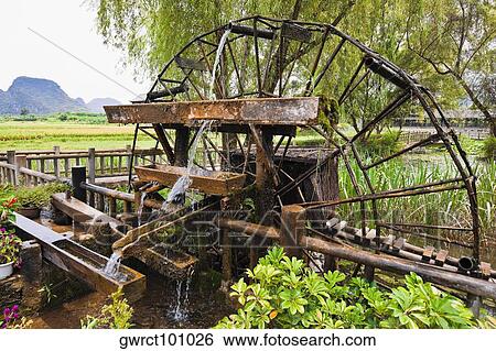 Watermill in a field, Yangshuo, Guangxi Province, China View Large Photo Image Stock Photograph - Watermill in a field, Yangshuo, Guangxi Province, China. Fotosearch