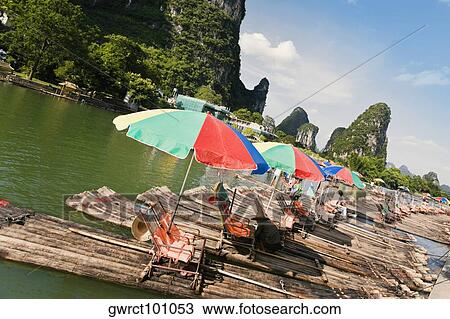Wooden rafts in a river, Li River, XingPing, Yangshuo, Guangxi Province, China View Large Photo Image Stock Image - Wooden rafts in a river, Li River, XingPing, Yangshuo, Guangxi Province, China. Fotosearch