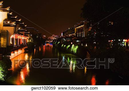 Buildings lit up at night, Nanjing, Jiangsu Province, China View Large Photo Image Stock Photo - Buildings lit up at night, Nanjing, Jiangsu Province, China. Fotosearch