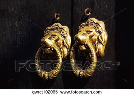 Stock Photography - Close-up of two door knockers, Tunxi Old Street, Tunxi District, Anhui Province, China. Fotosearch