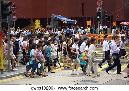 Stock Photo - Crowd walking in a street, Hong Kong Island, Hong Kong, China. Fotosearch