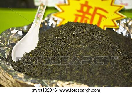 Dry tea leaves at a market stall, Qingdao, Shandong Province, China View Large Photo Image Stock Photograph - Dry tea leaves at a market stall, Qingdao, Shandong Province, China. Fotosearch