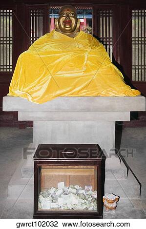 Laughing Buddha covered with a blanket in an altar, Beidaihe, China View Large Photo Image Stock Image - Laughing Buddha covered with a blanket in an altar, Beidaihe, China. Fotosearch