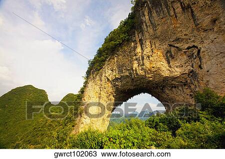 Natural arch formed at a hill, Moon Hill, Yangshuo, Guangxi Province, China View Large Photo Image Stock Image - Natural arch formed at a hill, Moon Hill, Yangshuo, Guangxi Province, China. Fotosearch