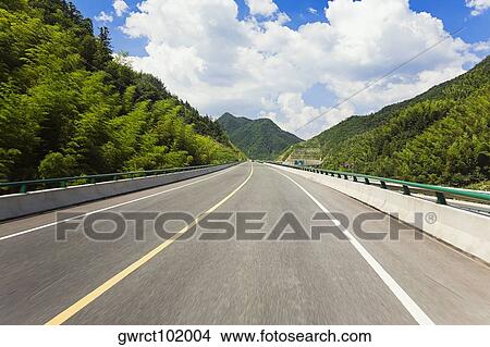 Road leading to a mountain range, Huangshan, Anhui province, China View Large Photo Image Picture - Road leading to a mountain range, Huangshan, Anhui province, China. Fotosearch