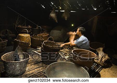 Side profile of a mature man weaving a bamboo basket, Jinkeng Terraced Field, Guangxi Province, China View Large Photo Image Picture - Side profile of a mature man weaving a bamboo basket, Jinkeng Terraced Field, Guangxi Province, China. Fotosearch