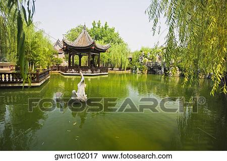 Statue in a pond, Yu Yin Shan Fang, Panyu, Guangzhou, Guangdong Province, China View Large Photo Image Stock Photo - Statue in a pond, Yu Yin Shan Fang, Panyu, Guangzhou, Guangdong Province, China. Fotosearch