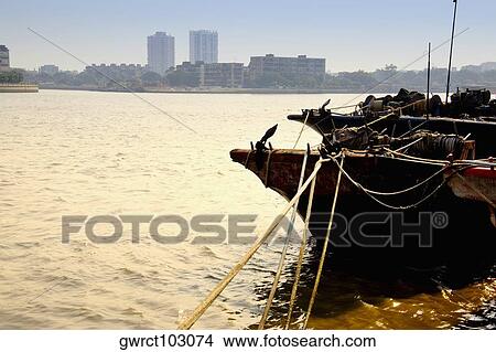 Boat moored in a river, Shamian Island, Guangzhou, Guangdong Province, China View Large Photo Image Picture - Boat moored in a river, Shamian Island, Guangzhou, Guangdong Province, China. Fotosearch
