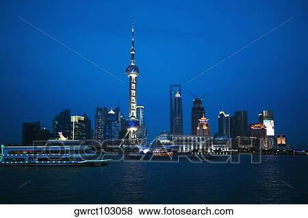 Stock Photo - Buildings at the waterfront, Oriental Pearl Tower, Huangpu River, Lujiazui, The Bund, Shanghai, China. Fotosearch