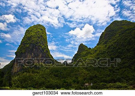 Clouds over a mountain range, Li River, XingPing, Yangshuo, Guangxi Province, China View Large Photo Image Picture - Clouds over a mountain range, Li River, XingPing, Yangshuo, Guangxi Province, China. Fotosearch