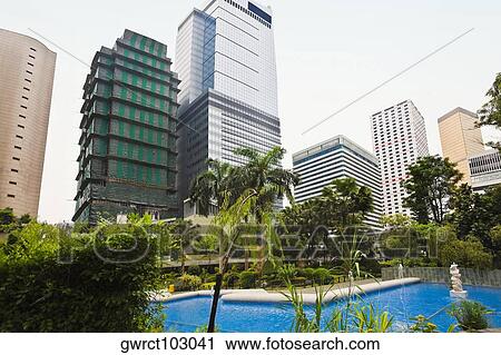 Low angle view of skyscrapers near a garden, Charter Garden, Hong Kong Island, China View Large Photo Image Stock Image - Low angle view of skyscrapers near a garden, Charter Garden, Hong Kong Island, China. Fotosearch