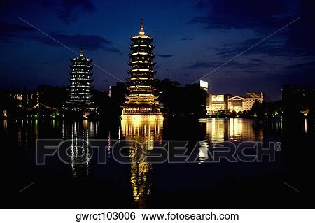 Pagodas at the waterfront, Sun and Moon Pagoda, Banyan Lake, Guilin, Guangxi Province, China View Large Photo Image Stock Photograph - Pagodas at the waterfront, Sun and Moon Pagoda, Banyan Lake, Guilin, Guangxi Province, China. Fotosearch
