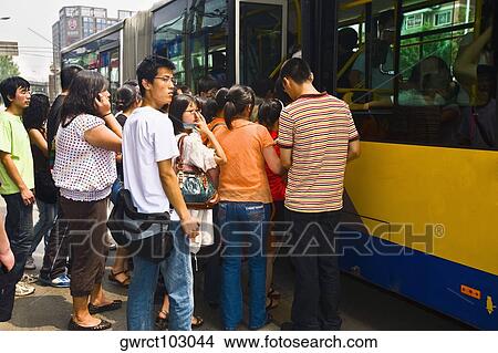 Passengers boarding in a bus, Beijing, China View Large Photo Image Picture - Passengers boarding in a bus, Beijing, China. Fotosearch