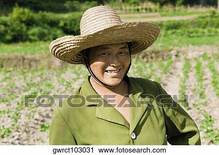 Portrait of a mature woman smiling in a field, Emerald Valley, Huangshan, Anhui Province, China View Large Photo Image Stock Image - Portrait of a mature woman smiling in a field, Emerald Valley, Huangshan, Anhui Province, China. Fotosearch