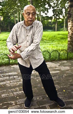 Senior man practicing kung fu, Temple Of Heaven, Beijing, China View Large Photo Image Picture - Senior man practicing kung fu, Temple Of Heaven, Beijing, China. Fotosearch