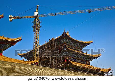 Low angle view of a crane at a construction site, HohHot, Inner Mongolia, China View Large Photo Image Stock Image - Low angle view of a crane at a construction site, HohHot, Inner Mongolia, China. Fotosearch