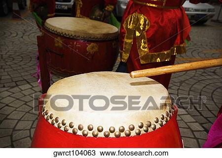 Man playing drum in a town square, Qingdao, Shandong Province, China View Large Photo Image Stock Image - Man playing drum in a town square, Qingdao, Shandong Province, China. Fotosearch