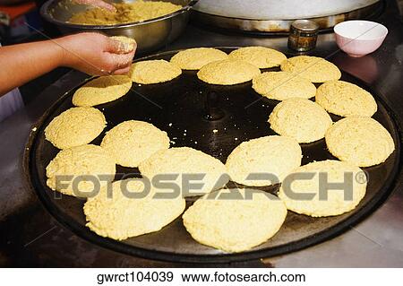 Person's hand preparing food in a restaurant, Qingdao, Shandong Province, China View Large Photo Image Stock Photo - Person's hand preparing food in a restaurant, Qingdao, Shandong Province, China. Fotosearch