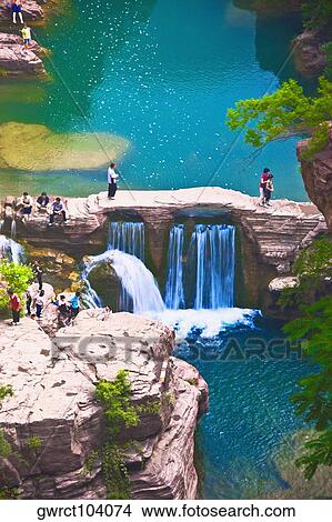Tourists on a bridge, Mt Yuntai, Jiaozuo, Henan Province, China View Large Photo Image Picture - Tourists on a bridge, Mt Yuntai, Jiaozuo, Henan Province, China. Fotosearch