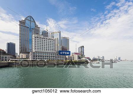 Stock Image - Buildings at the waterfront, Lujiazui, The Bund, Shanghai, China. Fotosearch