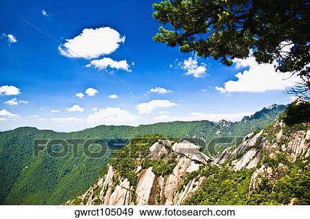 Clouds over a mountain range, Huangshan Mountains, Anhui Province, China View Large Photo Image Stock Photo - Clouds over a mountain range, Huangshan Mountains, Anhui Province, China. Fotosearch