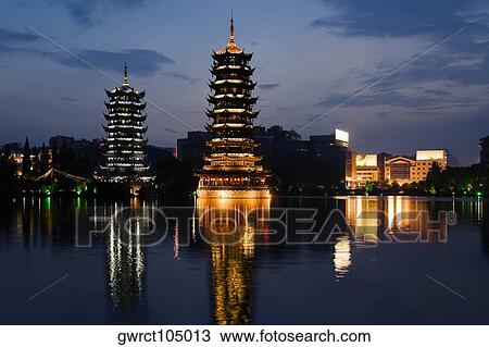 Pagodas at the waterfront, Sun and Moon Pagoda, Banyan Lake, Guilin, Guangxi Province, China View Large Photo Image Stock Image - Pagodas at the waterfront, Sun and Moon Pagoda, Banyan Lake, Guilin, Guangxi Province, China. Fotosearch