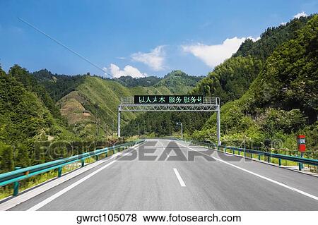 Stock Photo - Road passing through mountains, Huangshan Mountains, Anhui Province, China. Fotosearch