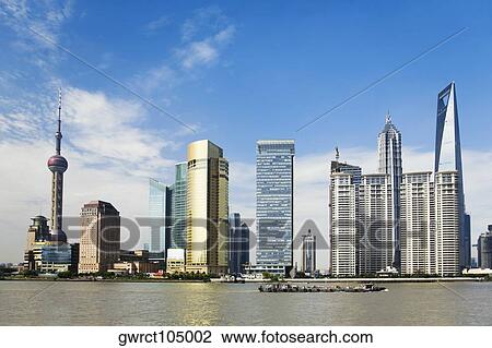 Skyscrapers at the waterfront, Oriental Pearl Tower, Huangpu River, Lujiazui, The Bund, Shanghai, China View Large Photo Image Stock Image - Skyscrapers at the waterfront, Oriental Pearl Tower, Huangpu River, Lujiazui, The Bund, Shanghai, China. Fotosearch