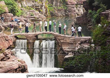 Stock Photo - Tourists crossing a river, Mt Yuntai, Jiaozuo, Henan Province, China. Fotosearch