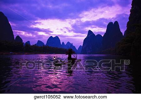 Wooden raft in a river, Li River, XingPing, Yangshuo, Guangxi Province, China View Large Photo Image Stock Image - Wooden raft in a river, Li River, XingPing, Yangshuo, Guangxi Province, China. Fotosearch