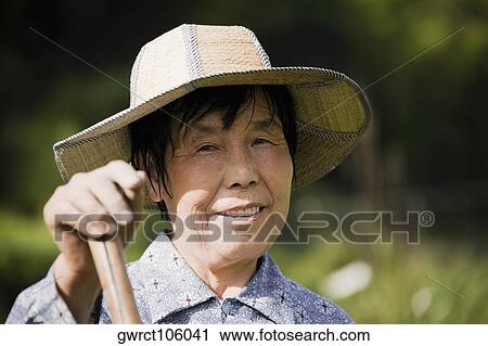 Portrait of a mature woman smiling, Emerald Valley, Huangshan, Anhui Province, China View Large Photo Image Stock Image - Portrait of a mature woman smiling, Emerald Valley, Huangshan, Anhui Province, China. Fotosearch