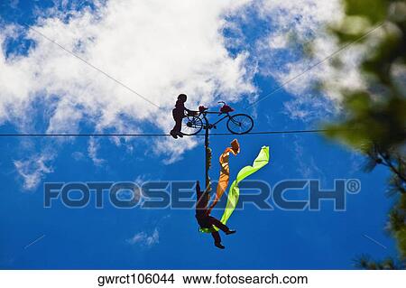 Silhouette of two performers performing stunt on a rope, Emerald Valley, Huangshan, Anhui Province, China View Large Photo Image Picture - Silhouette of two performers performing stunt on a rope, Emerald Valley, Huangshan, Anhui Province, China. Fotosearch