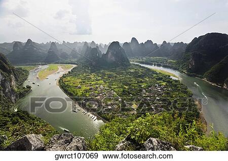 Aerial view of a river, Li River, XingPing, Yangshuo, Guangxi Province, China View Large Photo Image Stock Photo - Aerial view of a river, Li River, XingPing, Yangshuo, Guangxi Province, China. Fotosearch