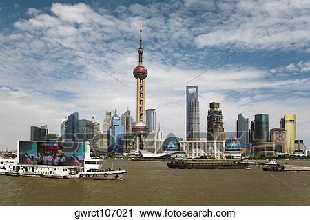Buildings at the waterfront, Oriental Pearl Tower, Huangpu River, Lujiazui, The Bund, Shanghai, China View Large Photo Image Stock Image - Buildings at the waterfront, Oriental Pearl Tower, Huangpu River, Lujiazui, The Bund, Shanghai, China. Fotosearch