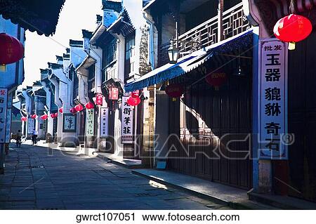 Chinese lanterns hanging outside the stores, Tunxi Old Street, Tunxi District, Anhui Province, China View Large Photo Image Stock Image - Chinese lanterns hanging outside the stores, Tunxi Old Street, Tunxi District, Anhui Province, China. Fotosearch
