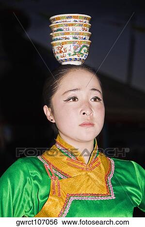 Close-up of a young woman dancing, Inner Mongolia, China View Large Photo Image Stock Photograph - Close-up of a young woman dancing, Inner Mongolia, China. Fotosearch