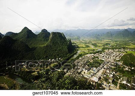 High angle view of a town, Xingping, Yangshuo, Guangxi Province, China View Large Photo Image Stock Photography - High angle view of a town, Xingping, Yangshuo, Guangxi Province, China. Fotosearch