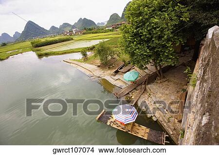 High angle view of a wooden raft in the river, Yangshuo, Guangxi Province, China View Large Photo Image Picture - High angle view of a wooden raft in the river, Yangshuo, Guangxi Province, China. Fotosearch