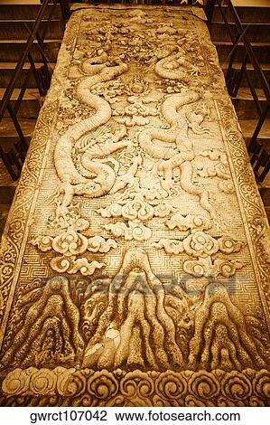 Stock Image - Low angle view of sculptures carved on a column, Temple Of Heaven, Beijing, China. Fotosearch