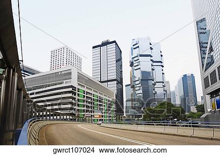 Low angle view of skyscrapers in a city, Des Voeux Road, Hong Kong Island, China View Large Photo Image Picture - Low angle view of skyscrapers in a city, Des Voeux Road, Hong Kong Island, China. Fotosearch