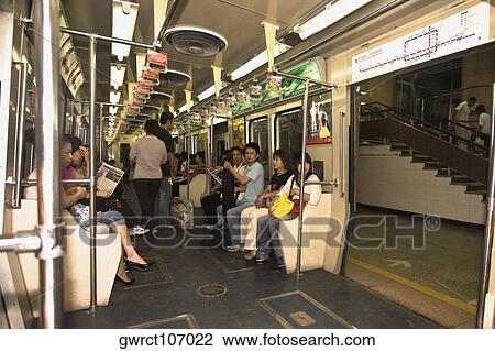 Passengers in a subway train, Beijing, China View Large Photo Image Stock Image - Passengers in a subway train, Beijing, China. Fotosearch