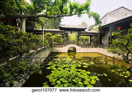 Pond in a garden, Yu Yin Shan Fang, Panyu, Guangzhou, Guangdong Province, China View Large Photo Image Stock Photo - Pond in a garden, Yu Yin Shan Fang, Panyu, Guangzhou, Guangdong Province, China. Fotosearch