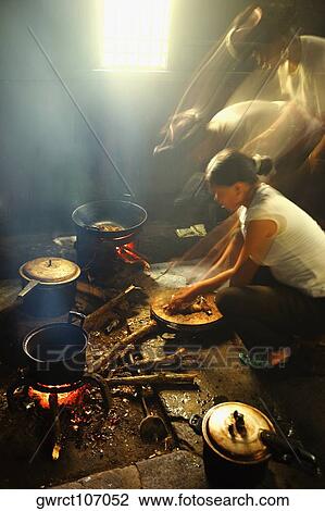 Side profile of a mid adult woman preparing food, Jinkeng Terraced Field, Guangxi Province, China View Large Photo Image Stock Image - Side profile of a mid adult woman preparing food, Jinkeng Terraced Field, Guangxi Province, China. Fotosearch