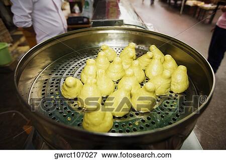 Stream breads on a steamer at a market stall, Qingdao, Shandong Province, China View Large Photo Image Stock Photo - Stream breads on a steamer at a market stall, Qingdao, Shandong Province, China. Fotosearch