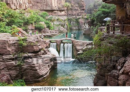 Tourist on a bridge, Mt Yuntai, Jiaozuo, Henan Province, China View Large Photo Image Stock Photo - Tourist on a bridge, Mt Yuntai, Jiaozuo, Henan Province, China. Fotosearch