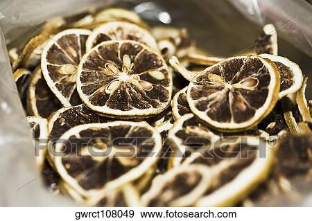 Close-up of dry lemon slices at a market stall, Tai'an, Shandong Province, China View Large Photo Image Stock Photo - Close-up of dry lemon slices at a market stall, Tai'an, Shandong Province, China. Fotosearch